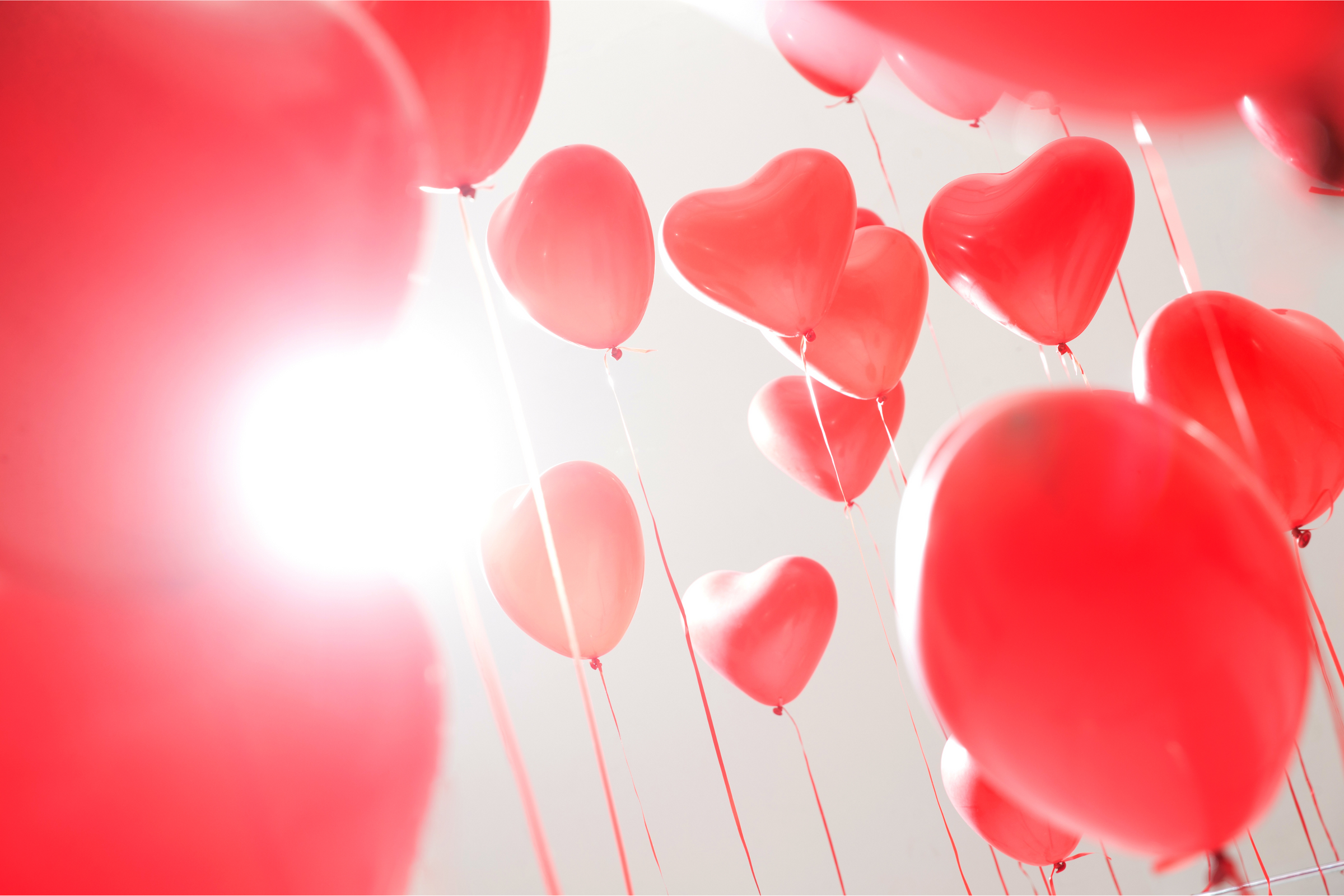 background of red heart shaped balloons