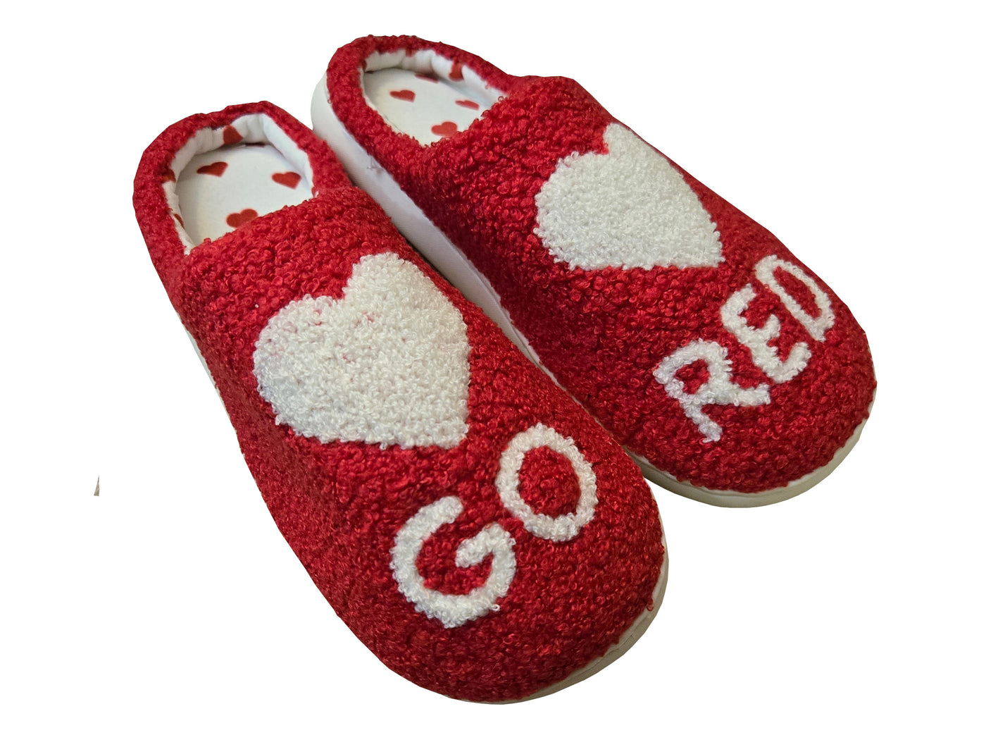 Red slippers with white heart and "GO and "RED" featured on right and left slipper. Footbed has polka dot heart pattern. 