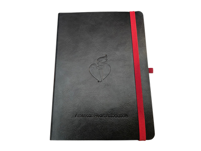 Black leather style cover with debossed Heart and Torch logo center and "American Heart Association" text on bottom. Red strap on right side to keep it closed.